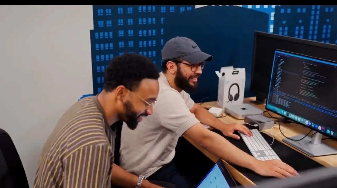 Javier working with a teammate at Xtern